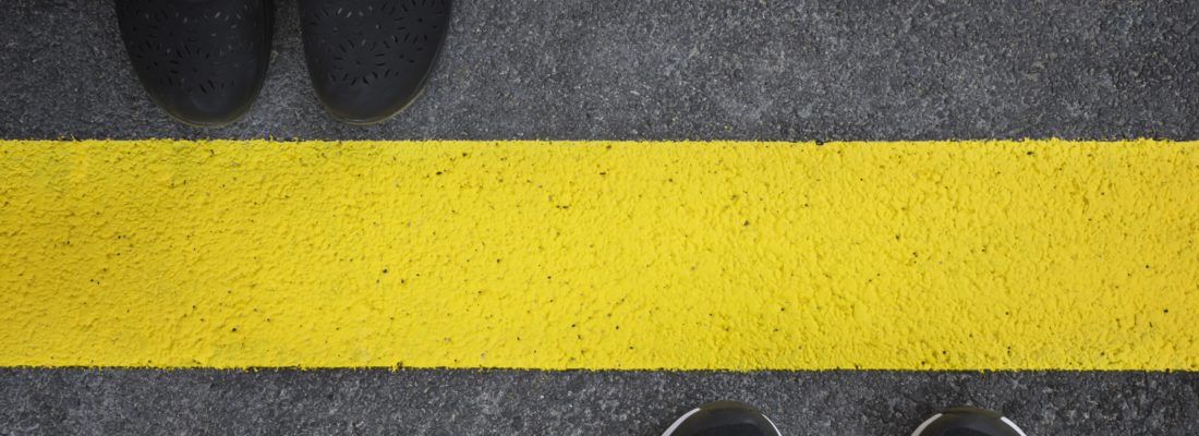 Legs of a couple standing opposite each other