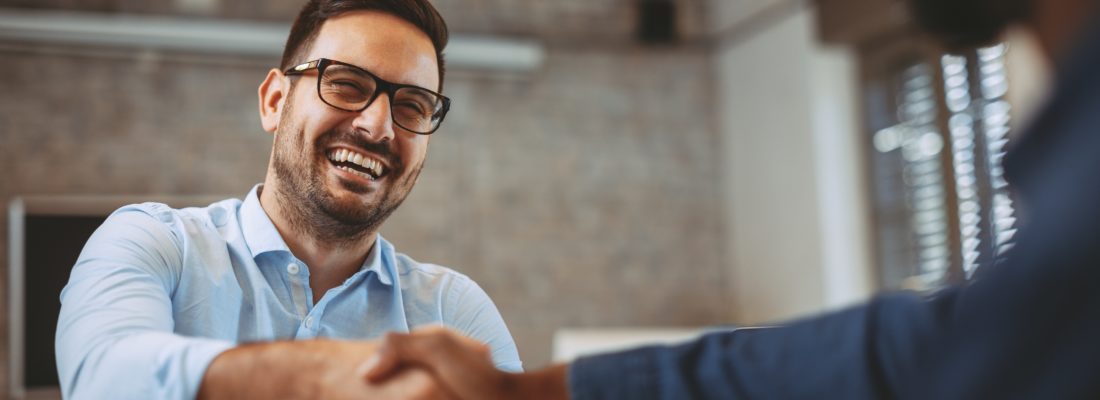 Close up of handshake in the office
